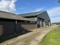 Foto van Gangbaar melkgeitenbedrijf met stolpboerderij
